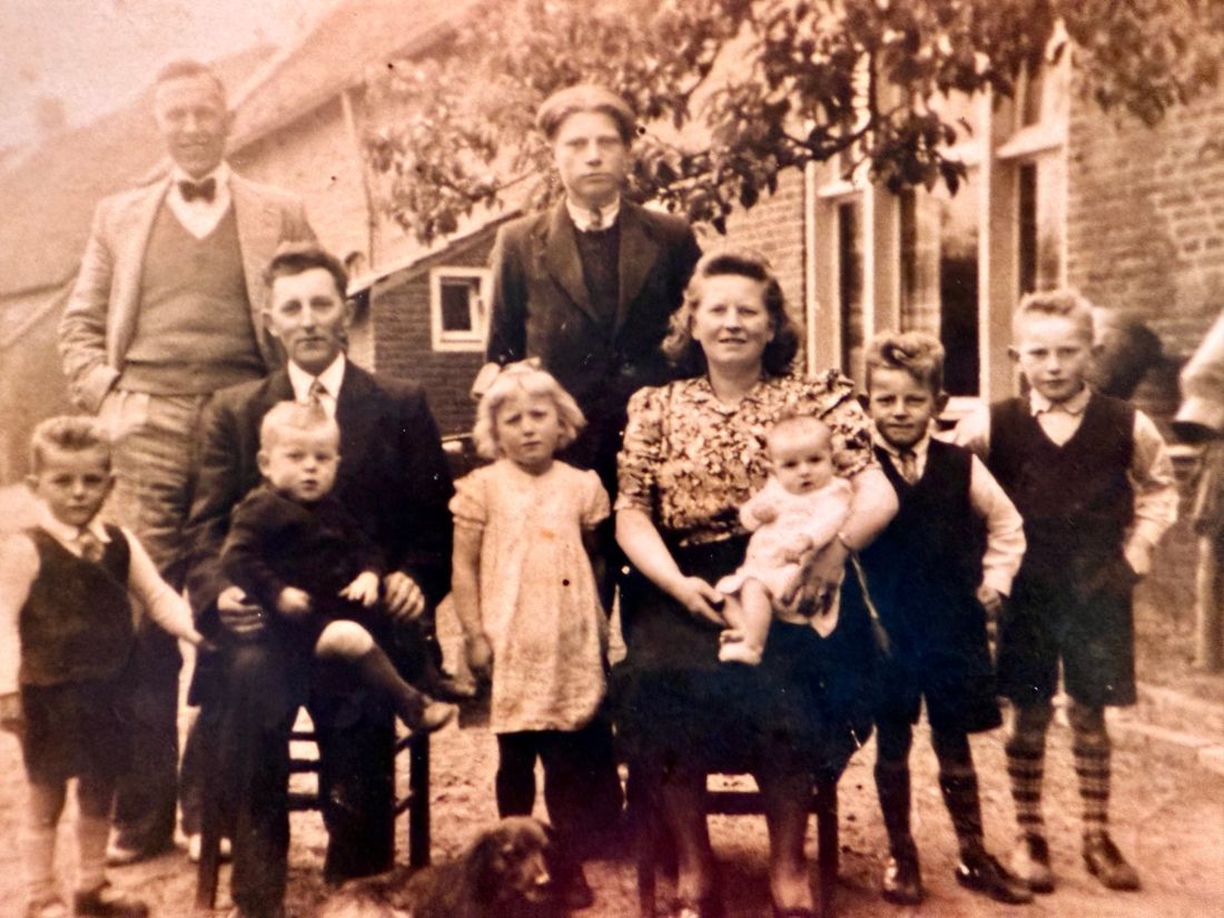 A large family gathered outdoors