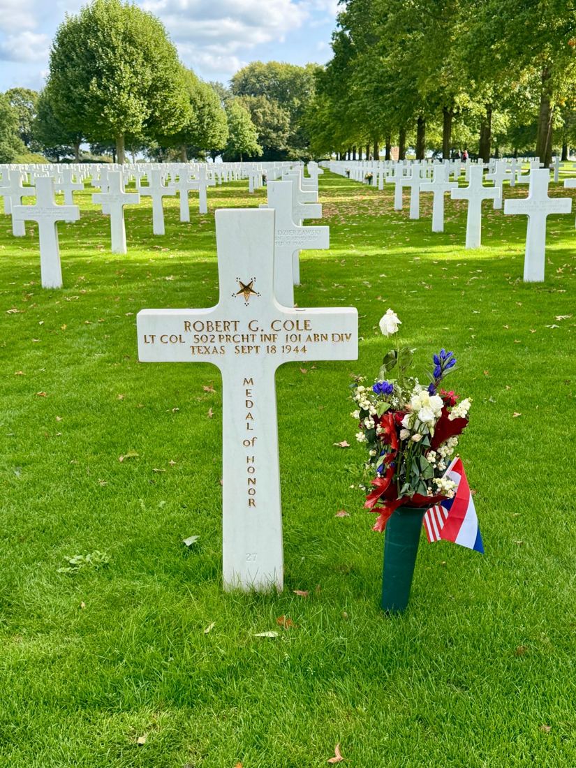 Grave of Lt. Col. Robert G. Cole with flowers and flags